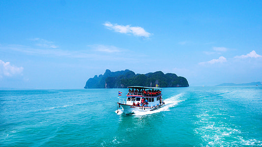white steel passenger boat on large body of water thumbnail