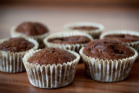 seven chocolate cupcakes on brown wooden surface thumbnail