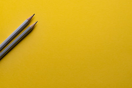 two pencil on yellow surface thumbnail