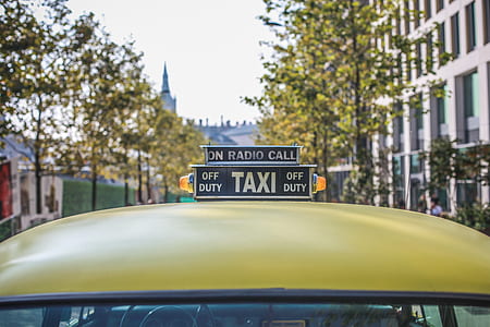 yellow Taxi vehicle during daytime thumbnail