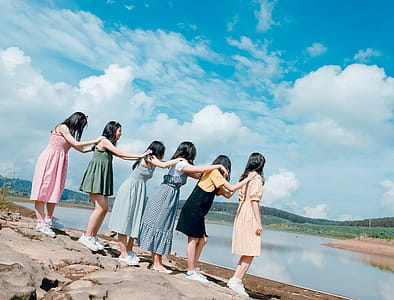 Six Women Standing Near Body Of Water thumbnail