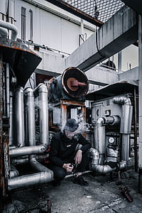 man vaping in factory thumbnail