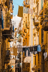 clothes hang between buildings thumbnail