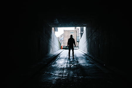 man standing under tunnel thumbnail