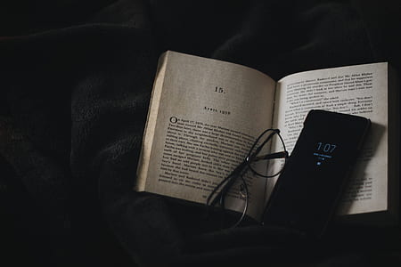 black Android smartphone on open book thumbnail