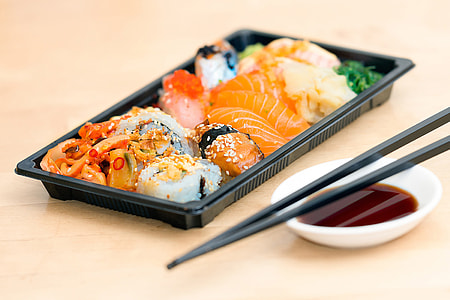 Closeup shot of sushi fish and chopsticks thumbnail