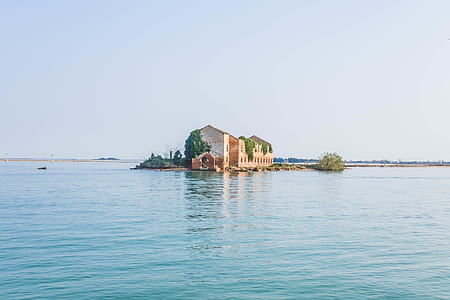 landscape photography of house surrounded by water thumbnail