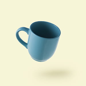 blue ceramic mug on white background thumbnail