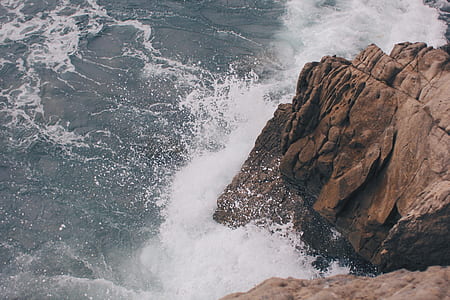 rock cliff with ocean wave thumbnail