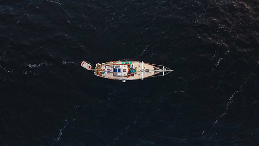 top view of white boat on body of water thumbnail