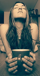 woman holding black ceramic mug thumbnail