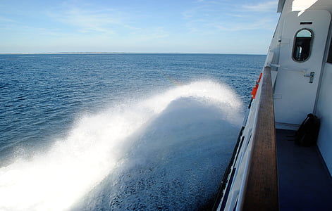 splash of water beside boat thumbnail