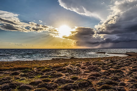 body of water during sunset thumbnail