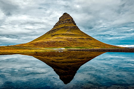 brown mountain with body of water thumbnail