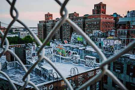 brown concrete building with graffiti wall arts thumbnail