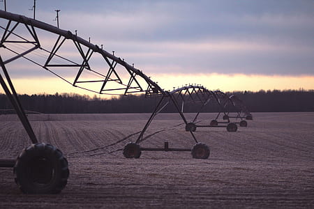 black metal wheeled conveyor on open field thumbnail
