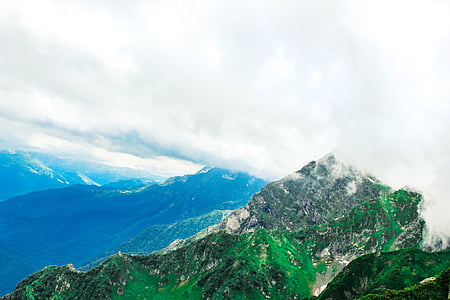 landscape photography of green mountains thumbnail