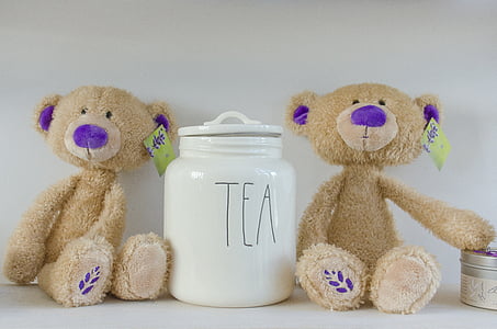 white ceramic jar in the middle two brown bear plush toys thumbnail