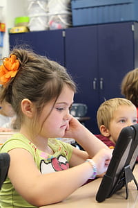 girl using tablet computer thumbnail