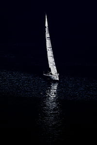 sail boat on body of water during nighttime thumbnail