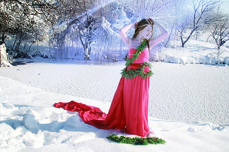 woman standing on snow-covered pavement during daytime thumbnail