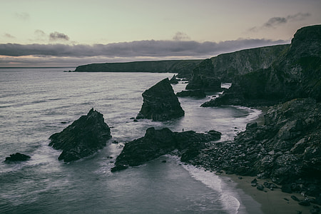 Wide-angle seascape photo taken in low light in Cornwall, England thumbnail