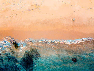 aerial photography of ocean waves on seashore thumbnail