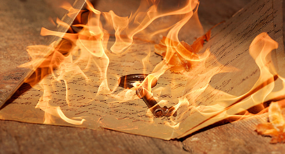 vintage paper covered with flame thumbnail