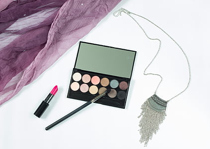 black eyeshadow palette with pink lipstick and brush thumbnail