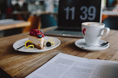 Working in a restaurant: Macbook, Cheese Cake and Cup of Coffee thumbnail