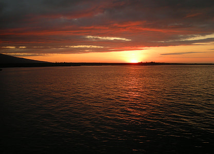 body of water and silhouette of island thumbnail