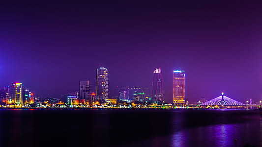 lightened city buildings at night time thumbnail