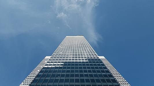 photo of white high-rise building under clear blue sky thumbnail