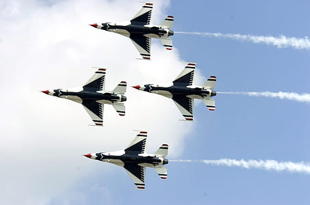 four fighter jets flying thumbnail