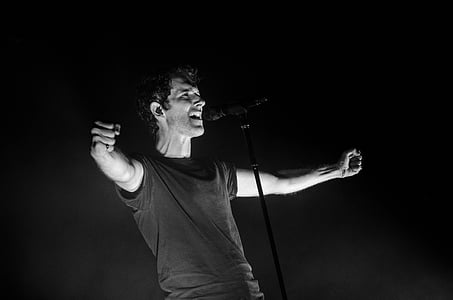 grayscale photo of man singing thumbnail