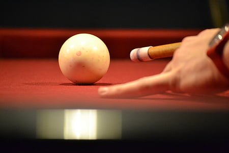 person holding cue stick thumbnail