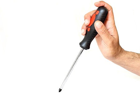 close-up photo of person holding black and gray screwdriver thumbnail