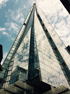 glass building under gray sky during daytime thumbnail