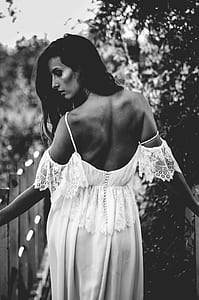 grayscale photo of woman near railings thumbnail