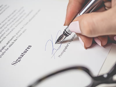 person signing on paper thumbnail