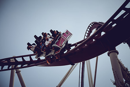 people riding on roller coaster thumbnail