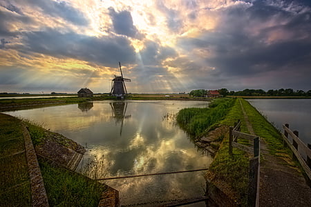 body of water under blue sky thumbnail