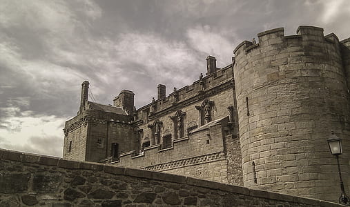 grey concrete castle under cloudy sky during daytime thumbnail