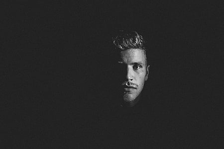 man's face in grayscale photo thumbnail