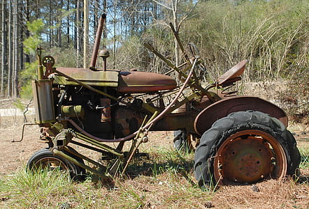 brown tractor on open field thumbnail