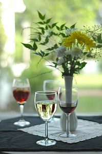 clear wine glass with clear liquid in it in bokeh photography thumbnail