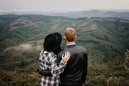 man and woman viewing mountain rage during daytime thumbnail