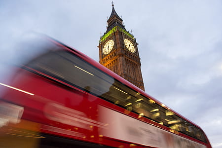 time-lapse photography of bus beside The Elizabeth Tower in London thumbnail