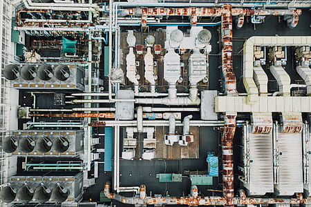aerial view photo of white, teal, and black industrial machine thumbnail