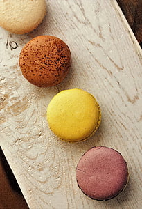 four round cupcakes on brown wooden surface thumbnail